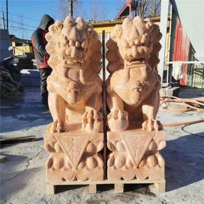 晚霞红踩球狮子雕塑