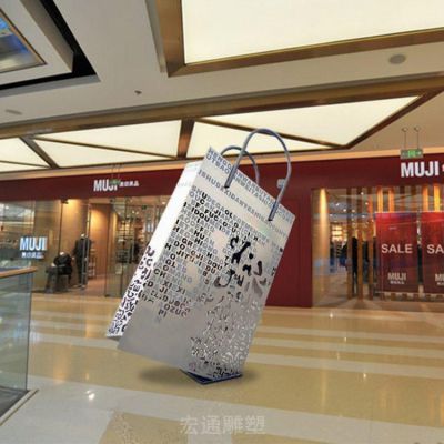 不锈钢镂空购物袋校园雕塑